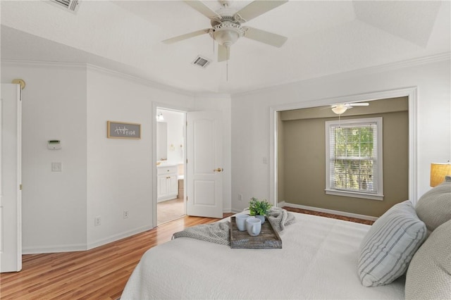 142 Montrose, Saint Simons Island, GA 31522 - bedroom featuring light wood-style flooring, crown molding, baseboards, a ceiling fan, and ensuite bathroom