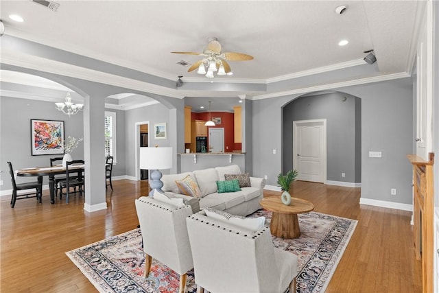 142 Montrose, Saint Simons Island, GA 31522 - living room featuring arched walkways, ceiling fan, baseboards, crown molding, and recessed lighting