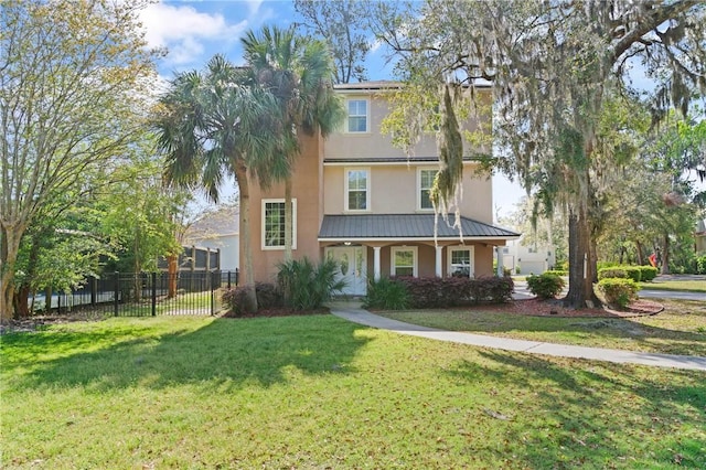142 Montrose, Saint Simons Island, GA 31522 - view of front of property featuring stucco siding and metal roof