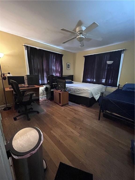 1401 Carswell Ave, Waycross, GA 31501 - bedroom featuring wood finished floors, a desk, and a ceiling fan