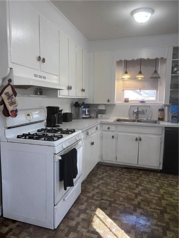 1401 Carswell Ave, Waycross, GA 31501 - kitchen featuring white gas stove, under cabinet range hood, a sink, light countertops, and white cabinets