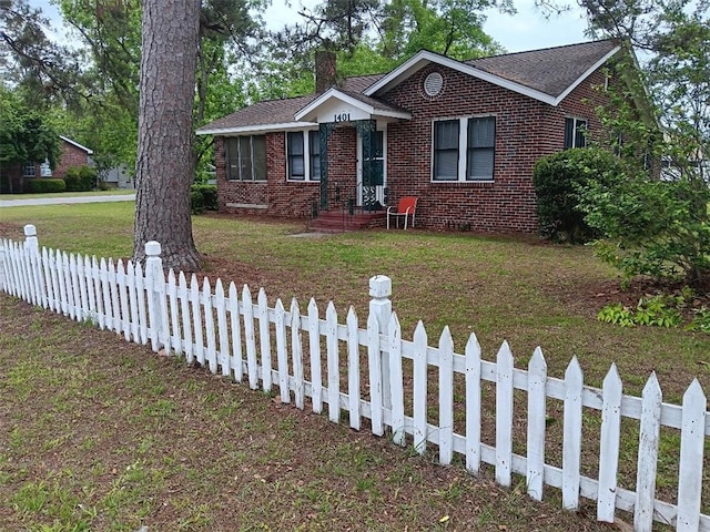 1401 Carswell Ave, Waycross, GA 31501 - view of front of house featuring brick siding, a chimney, and roof with shingles