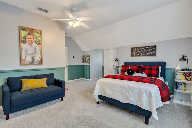 bedroom with lofted ceiling, carpet flooring, visible vents, and ceiling fan