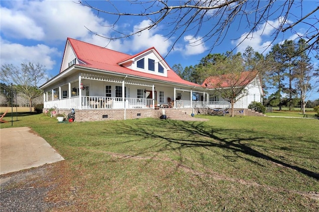 farmhouse with crawl space, a porch, a front yard, and metal roof