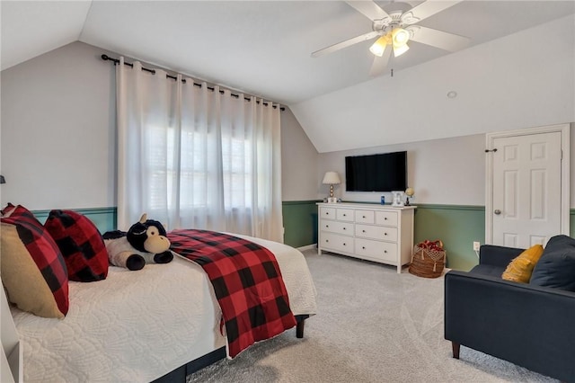 bedroom featuring light colored carpet, a ceiling fan, and vaulted ceiling