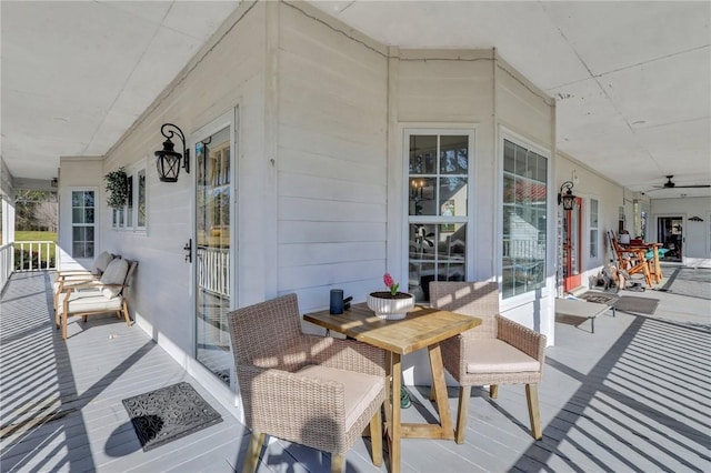 wooden terrace with a porch