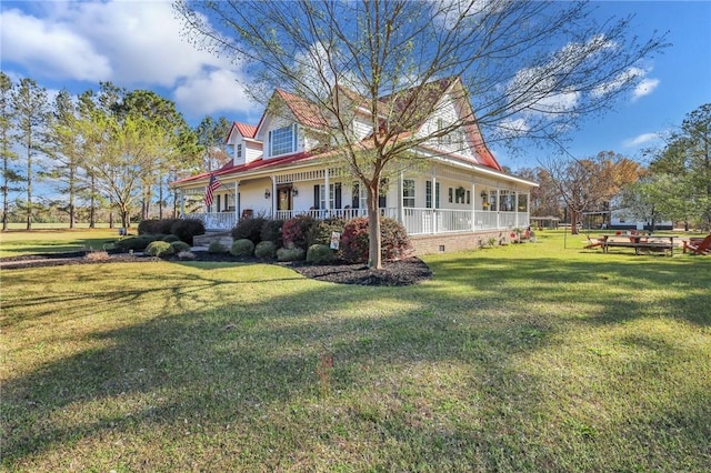 view of side of home with crawl space, a porch, and a yard