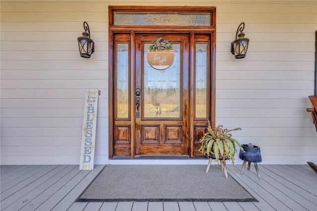 view of exterior entry featuring a porch