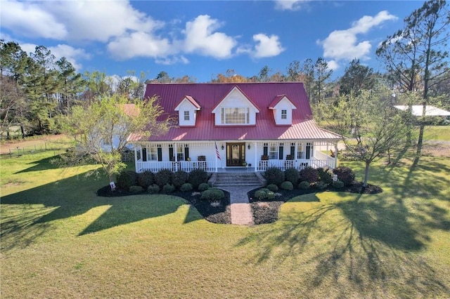 cape cod home featuring a porch, a front lawn, and metal roof