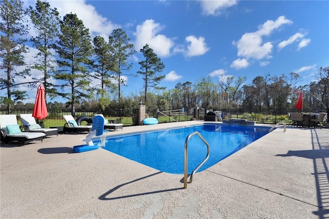 view of pool with a fenced in pool, a patio, and fence