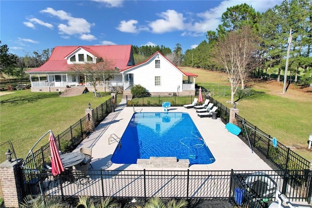 view of pool with a patio, a fenced in pool, a lawn, and fence