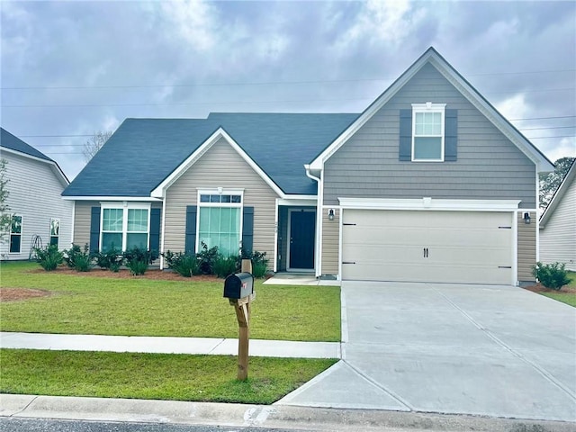 view of front facade with driveway and a front yard