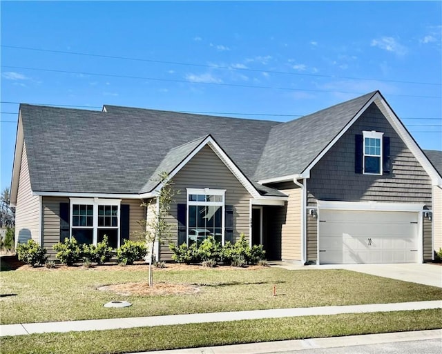 view of front facade with a garage, concrete driveway, and a front lawn