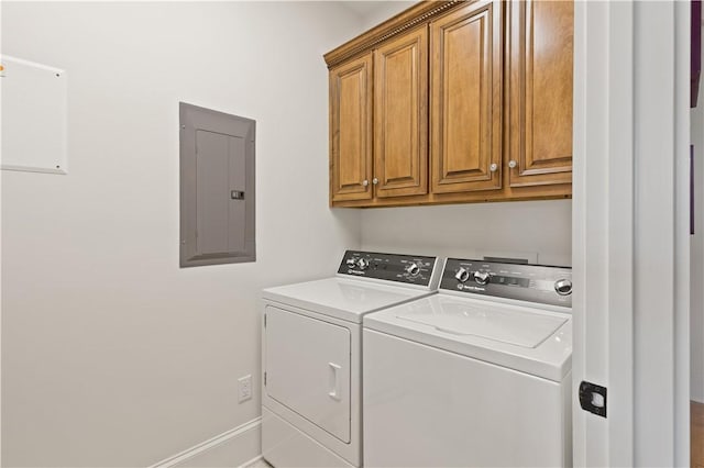 800 Ocean Blvd Unit 205, Saint Simons Island, GA 31522 - laundry area with cabinets, washing machine and dryer, and electric panel