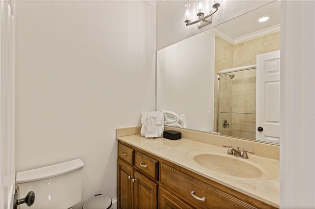 800 Ocean Blvd Unit 205, Saint Simons Island, GA 31522 - bathroom with crown molding, vanity, a shower with shower door, and toilet