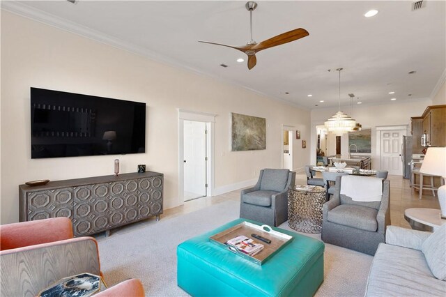 800 Ocean Blvd Unit 205, Saint Simons Island, GA 31522 - tiled living room with ceiling fan, sink, and ornamental molding