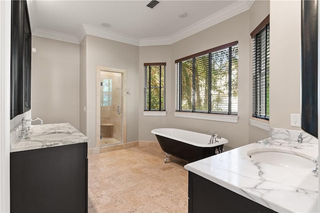 bathroom featuring vanity, ornamental molding, and separate shower and tub