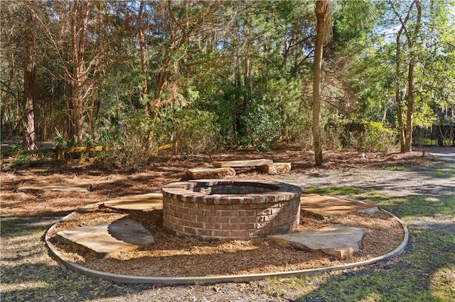 view of yard with an outdoor fire pit