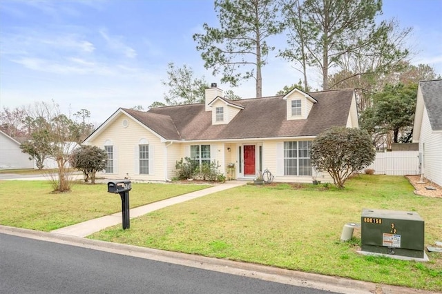 new england style home with a front lawn