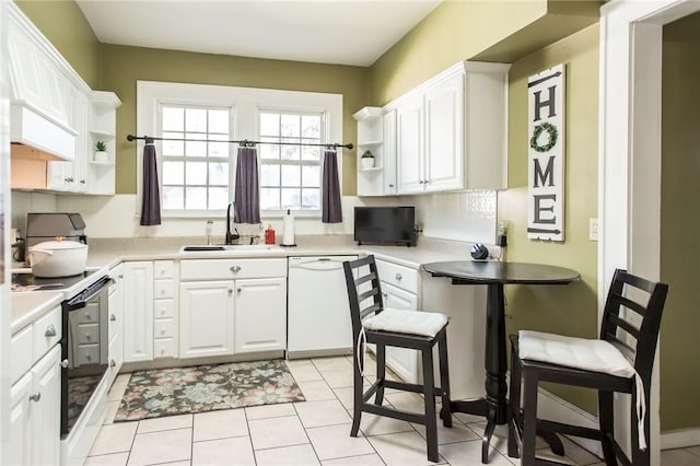 kitchen with a sink, open shelves, range with electric stovetop, and white dishwasher