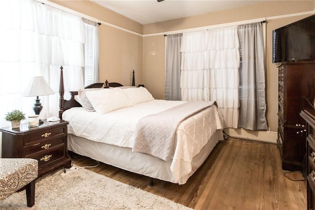 bedroom with wood finished floors