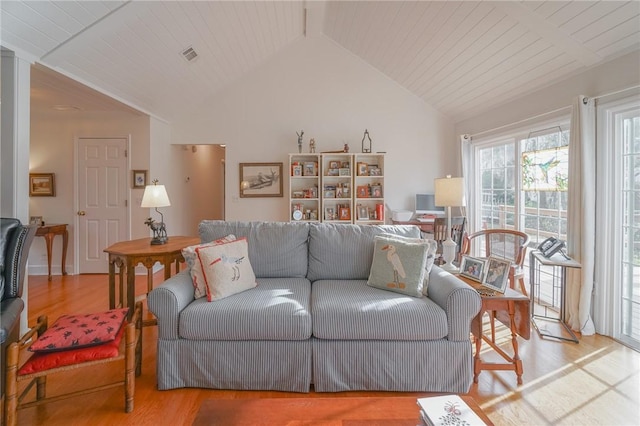 living room with visible vents, lofted ceiling, wood ceiling, and wood finished floors