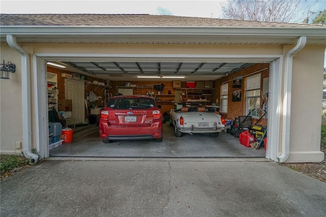 garage featuring aphalt driveway