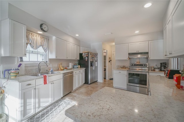 kitchen with recessed lighting, a sink, stainless steel appliances, white cabinets, and under cabinet range hood