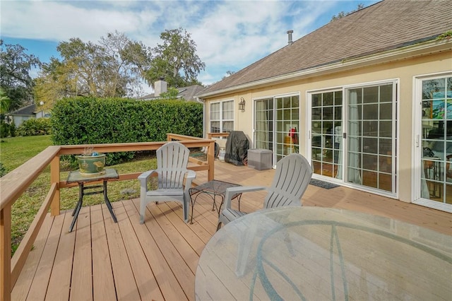 wooden deck with outdoor dining area