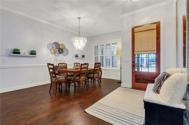 dining room featuring a notable chandelier, baseboards, ornamental molding, and dark wood-type flooring