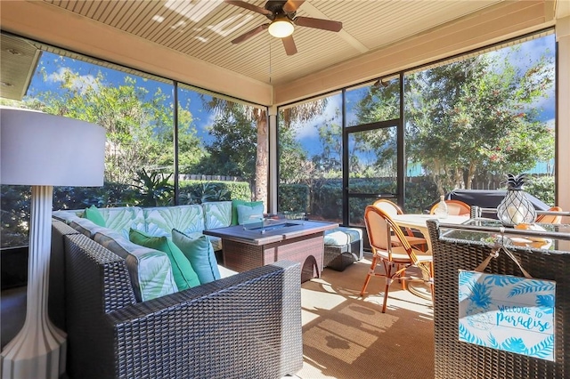 sunroom with a ceiling fan