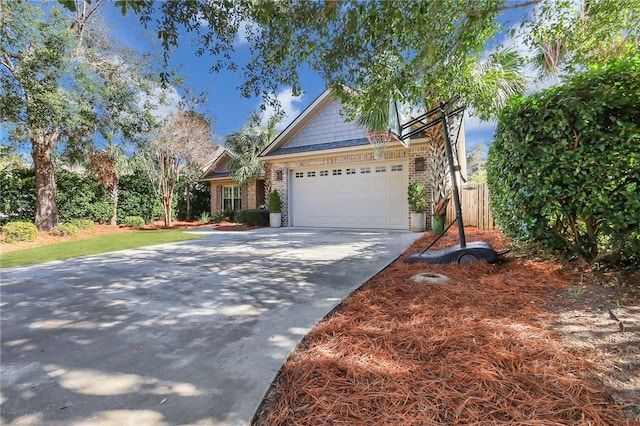 craftsman-style house featuring a garage, concrete driveway, and brick siding