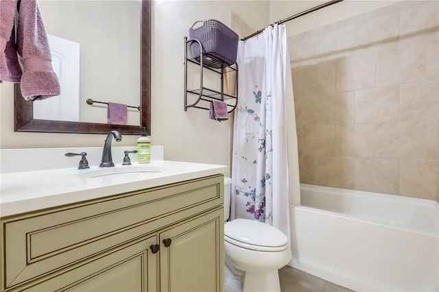 bathroom featuring toilet, tile patterned flooring, shower / bath combination with curtain, and vanity