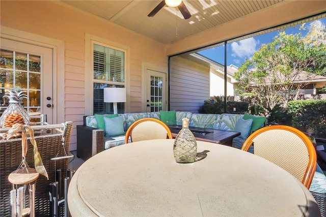 sunroom with a ceiling fan