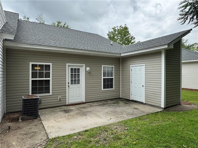 448 Moss Creek Ln, Brunswick, GA 31520 - back of house with roof with shingles, a patio, and a yard