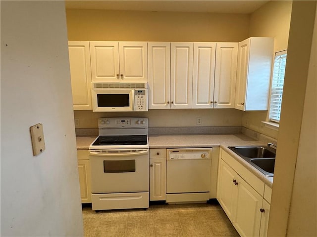 448 Moss Creek Ln, Brunswick, GA 31520 - kitchen with white appliances, white cabinetry, and light countertops