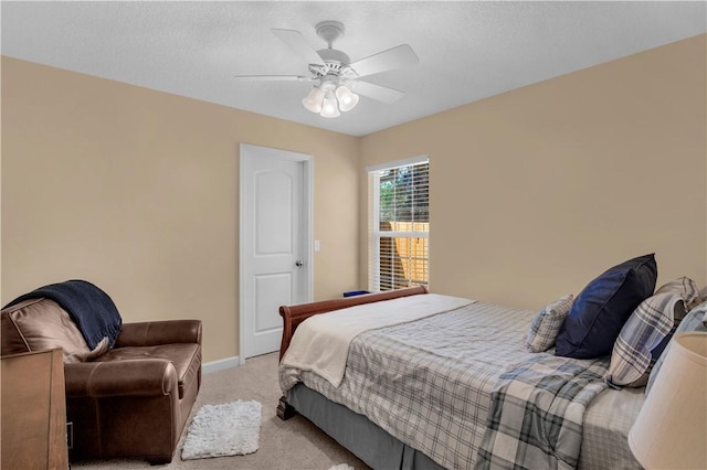 bedroom featuring ceiling fan and light colored carpet