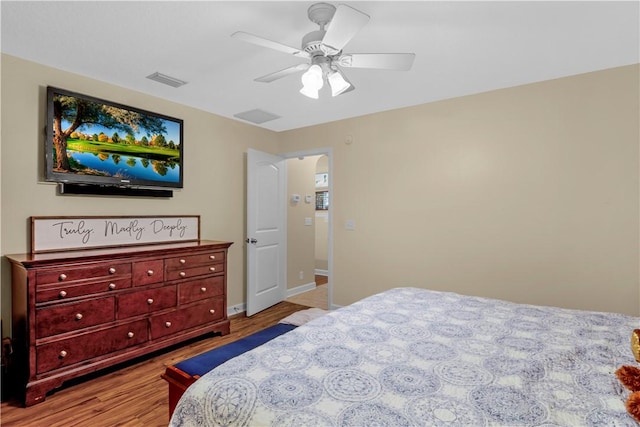 bedroom featuring light hardwood / wood-style floors and ceiling fan