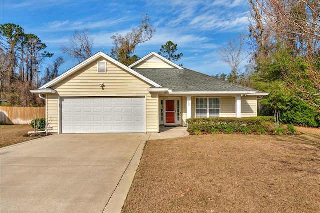 view of front of house featuring a garage and a front lawn