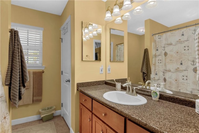 bathroom with vanity, tile patterned flooring, and walk in shower