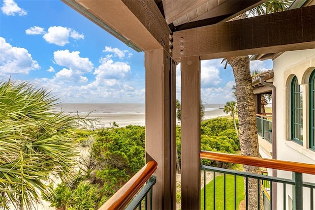 balcony with a view of the beach and a water view