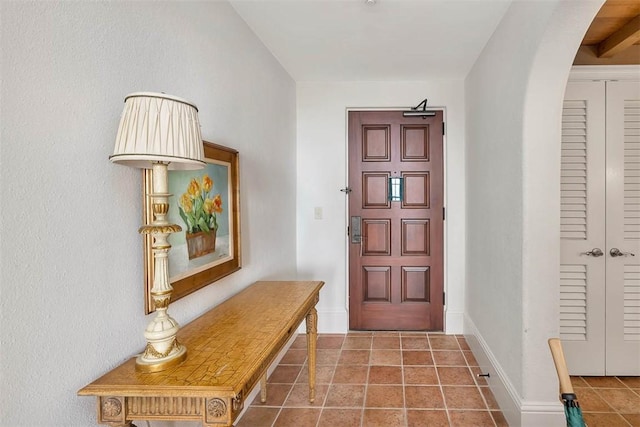 entryway with tile patterned floors