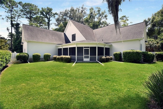 103 Bellrain Ln, Saint Simons Island, GA 31522 - rear view of house featuring a sunroom and a shingled roof