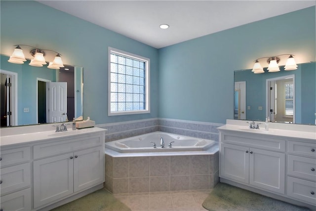 103 Bellrain Ln, Saint Simons Island, GA 31522 - bathroom featuring two vanities, a bath, and tile patterned floors