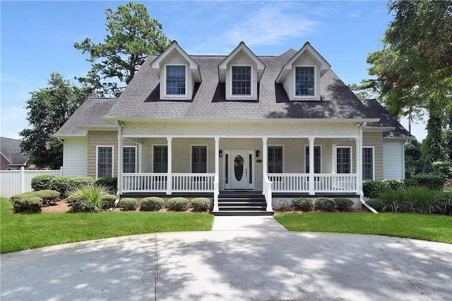 103 Bellrain Ln, Saint Simons Island, GA 31522 - cape cod-style house featuring a porch and roof with shingles