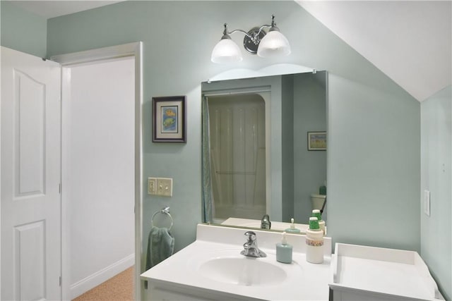 103 Bellrain Ln, Saint Simons Island, GA 31522 - bathroom featuring vanity and vaulted ceiling