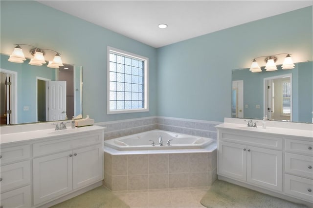 103 Bellrain Ln, Saint Simons Island, GA 31522 - bathroom featuring two vanities, a garden tub, and tile patterned flooring
