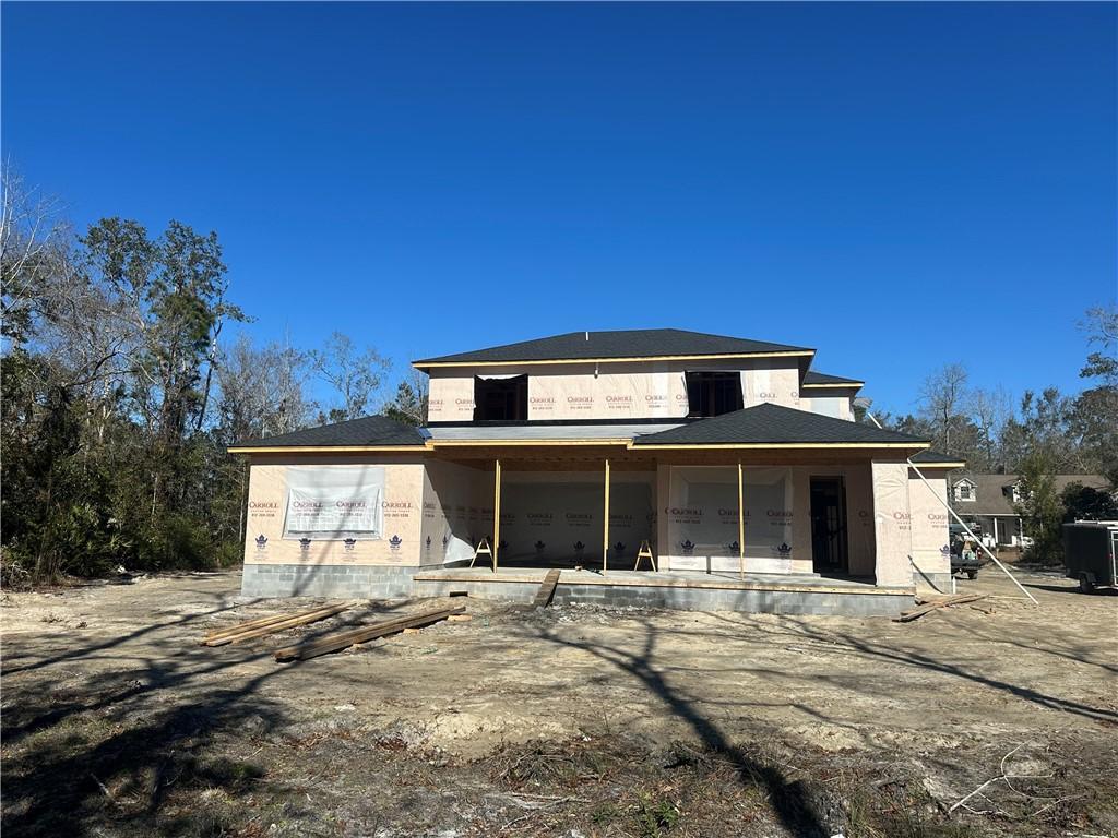 back of house with a patio