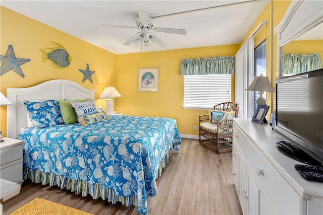 bedroom featuring ceiling fan and light wood-type flooring