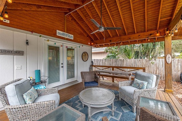 view of patio / terrace featuring ceiling fan, french doors, fence, and an outdoor living space